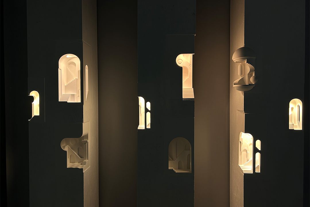 Embedded concrete wall light guiding circulation in a hotel corridor with subtle indirect illumination.