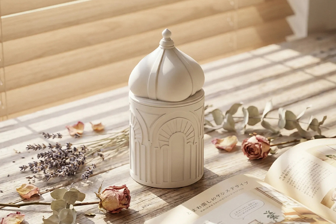 Close-up of concrete candle jars showing matte texture and refined finish